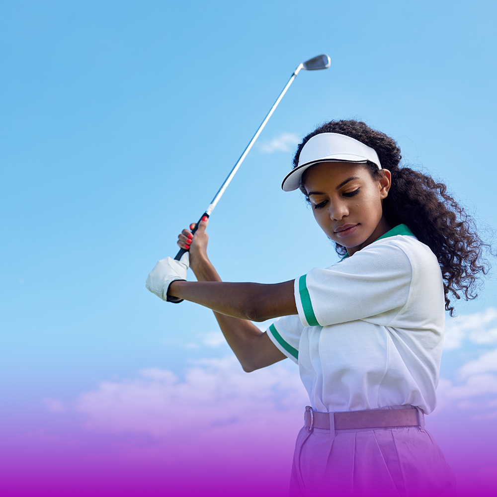 Woman golfing